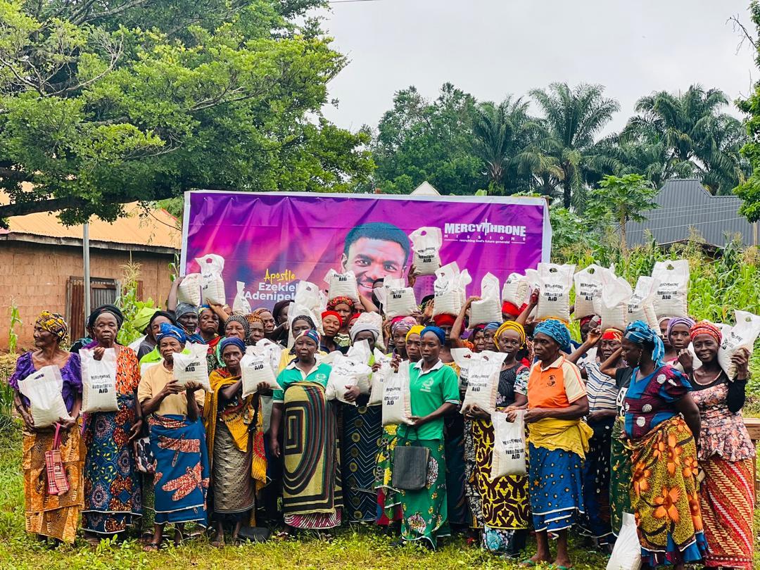 Women holding food support bags during outreach