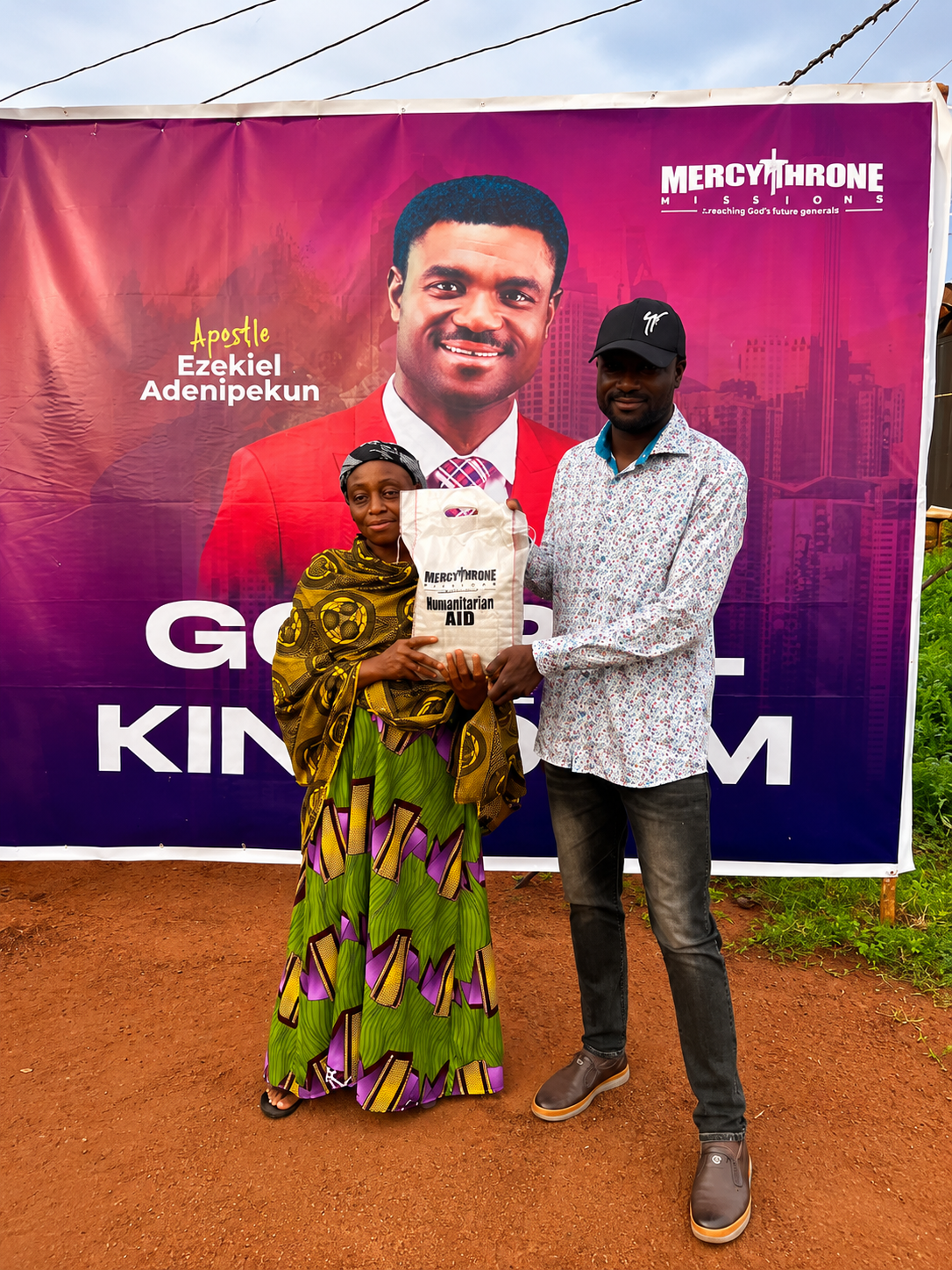 A woman receiving a food support bag during community outreach
