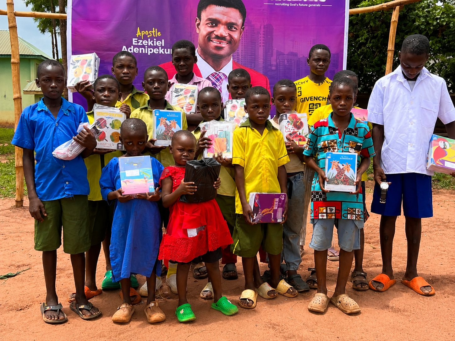 Children holding supplies during a community outreach